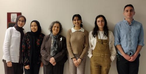 ME/SA Research Conference student presenters standing with Professor Suad Joseph for a photo.